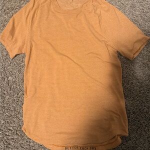 lululemon athletica Men's Short Sleeve Tee in Orange barley worn